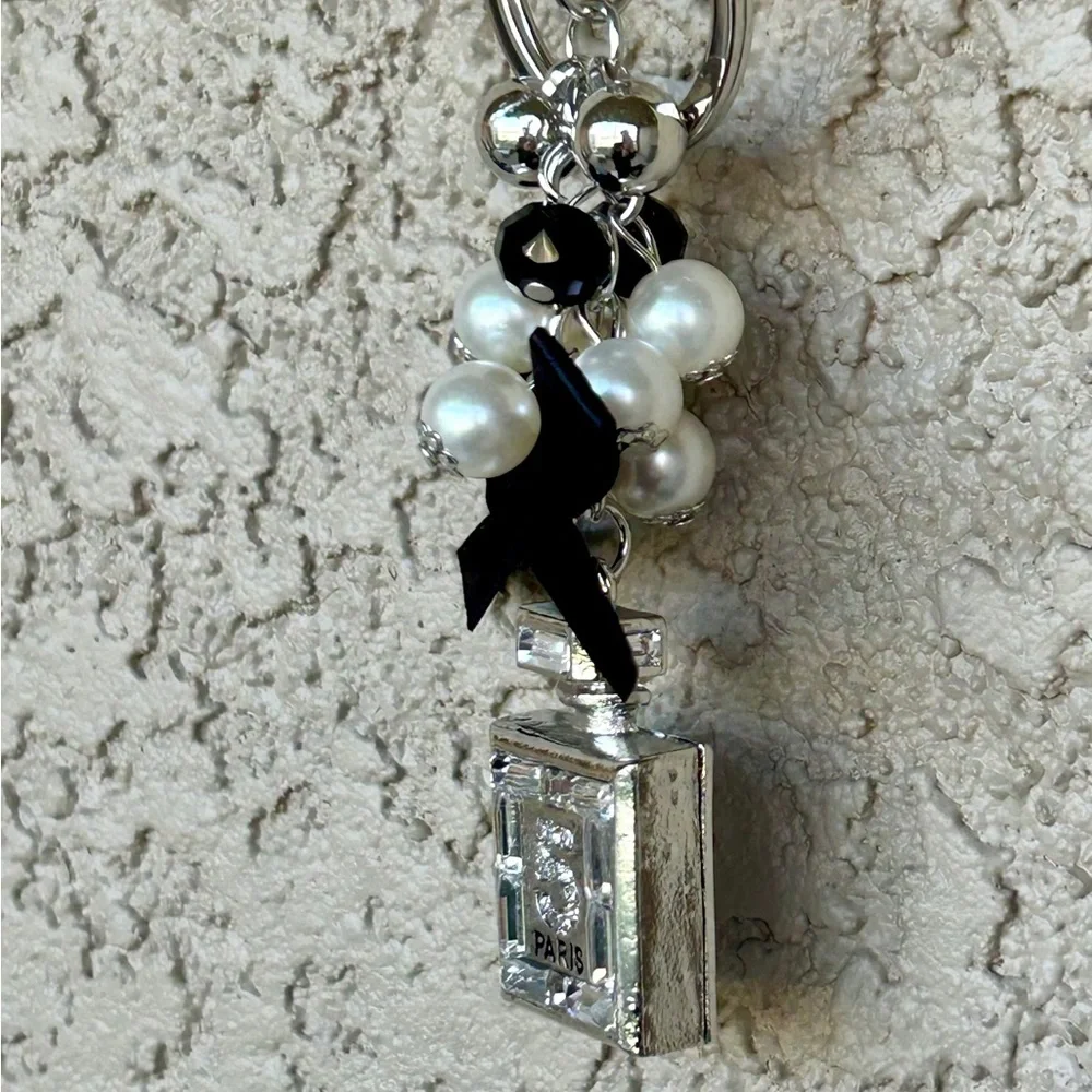 Luxe Silver Perfume Bottle Keychain/Bag Charm with Black Bow